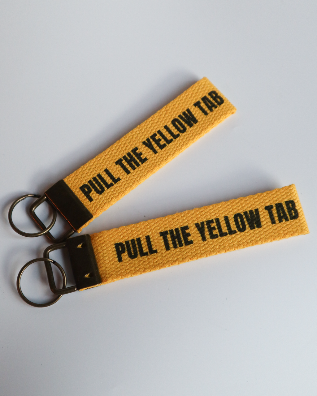 Pull The Yellow Tab Keyring